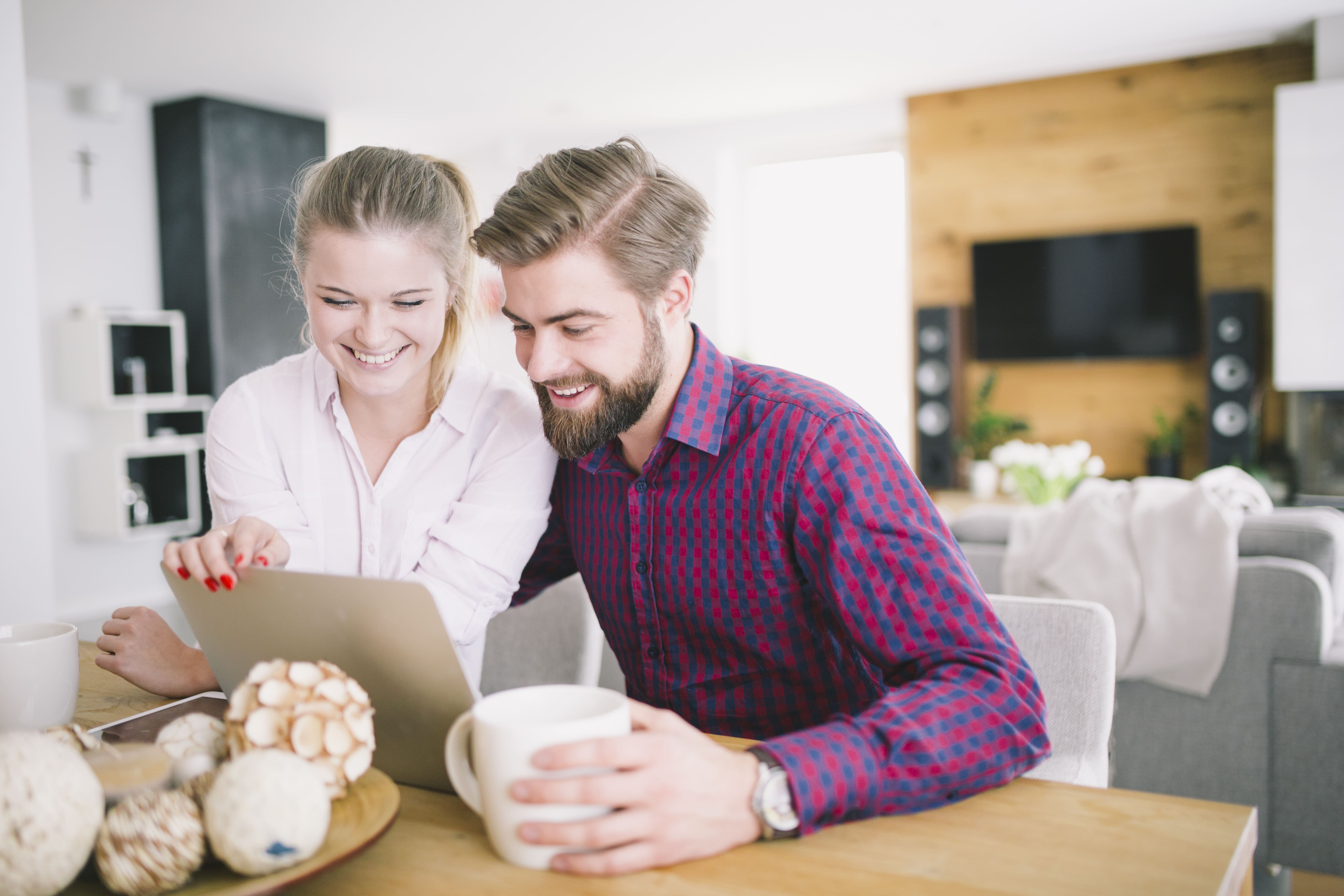 Couple receiving instant property alerts